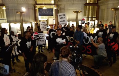 OSBORNE-albany-protest-reading-names-IS