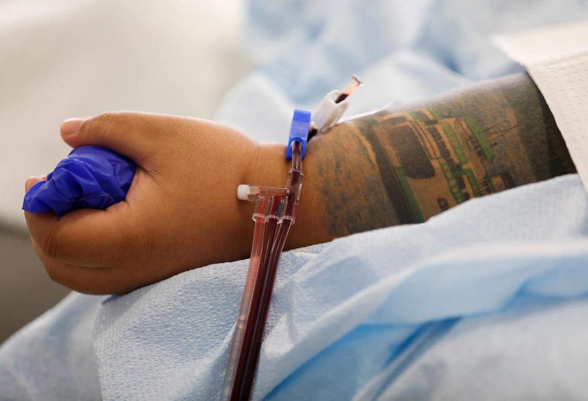 FILE PHOTO: Cruz, an ER technician at Valley Medical Center in Renton, donates convalescent plasma at Bloodworks Northwest for an experimental treatment study during the coronavirus disease (COVID-19) outbreak in Seattle