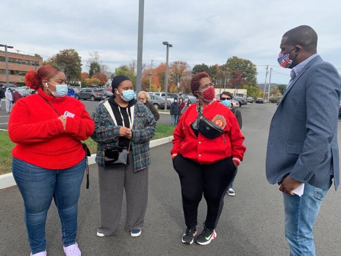 Mondaire Jones speaks with individuals during a campaign stop in Clarkstown on October 25, 2020.