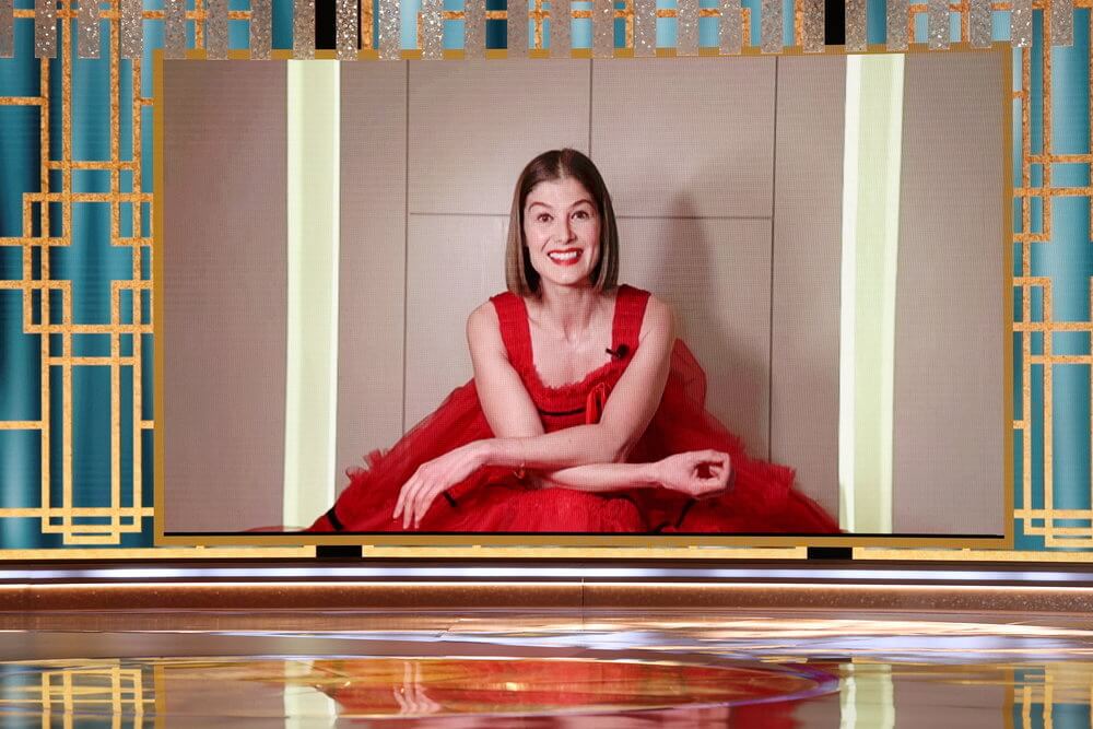 Rosamund Pike accepts the Best Actress – Motion Picture – Musical/Comedy award for “I Care a Lot” in this handout photo from the 78th Annual Golden Globe Awards in Beverly Hills