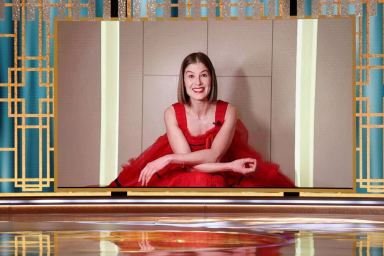 Rosamund Pike accepts the Best Actress – Motion Picture – Musical/Comedy award for “I Care a Lot” in this handout photo from the 78th Annual Golden Globe Awards in Beverly Hills