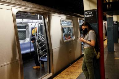 Passengers ride aboard the MTA’s New York City Transit subway, in New York