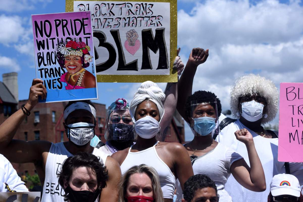 People participate in a Black Trans Lives Matter rally