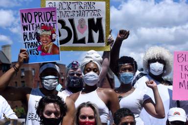 People participate in a Black Trans Lives Matter rally