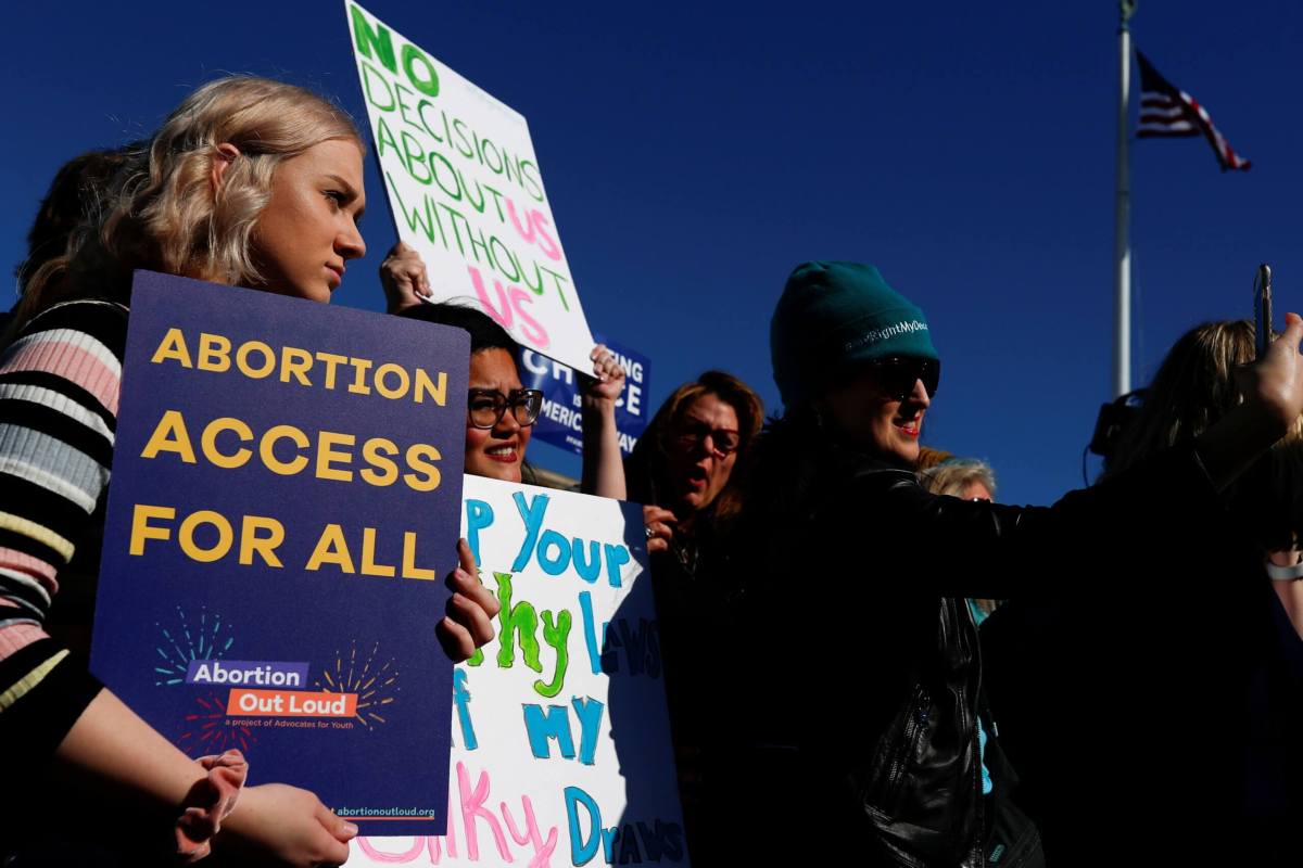 FILE PHOTO: U.S. Supreme Court justices hear a major abortion case on the legality of a Republican-backed Louisiana law that imposes restrictions on abortion doctors, on Capitol Hill in Washington