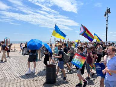 The sun beams down on the Riegelmann Boardwalk during the sixth annual Brighton Beach Pride March in Brooklyn.