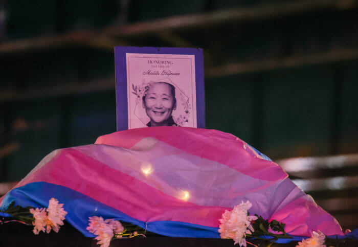 A Transgender Flag rests at the Corona Plaza vigil.