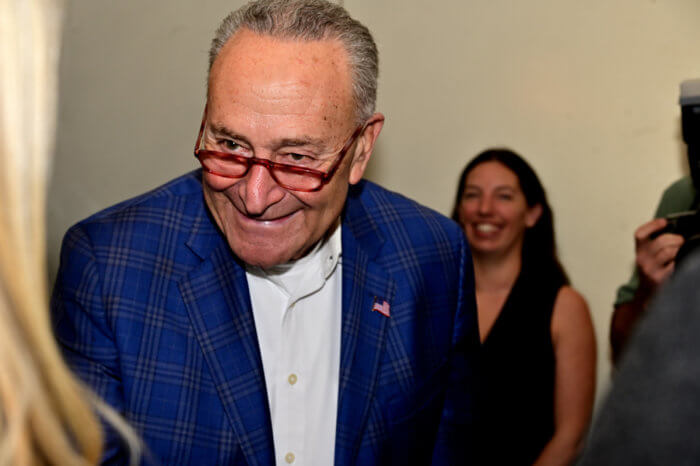 Senate Majority Leader Chuck Schumer greets attendees.