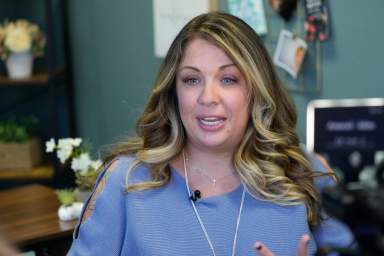 Web designer Lorie Smith is shown in her office.