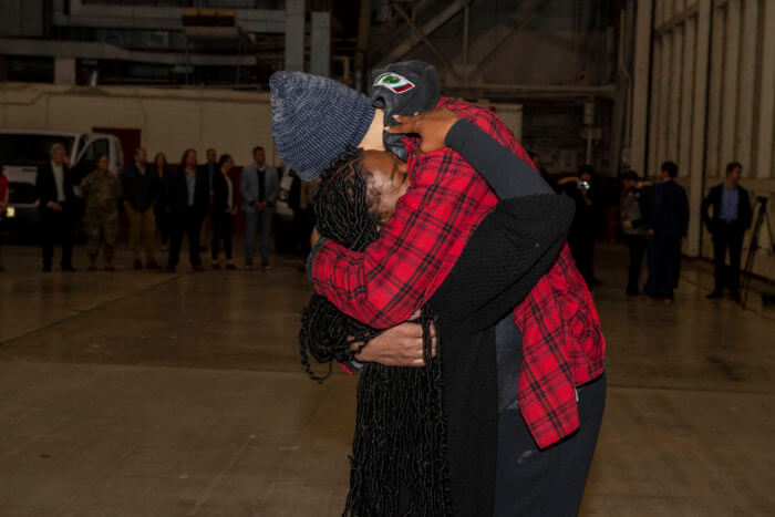 Brittney Griner embraces her wife, Cherelle Griner. at Kelly Field in San Antonio.