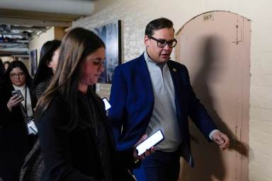 Rep. George Santos, R-N.Y., departs after attending a House GOP conference meeting on Capitol Hill in Washington, Tuesday, Jan. 10, 2023.