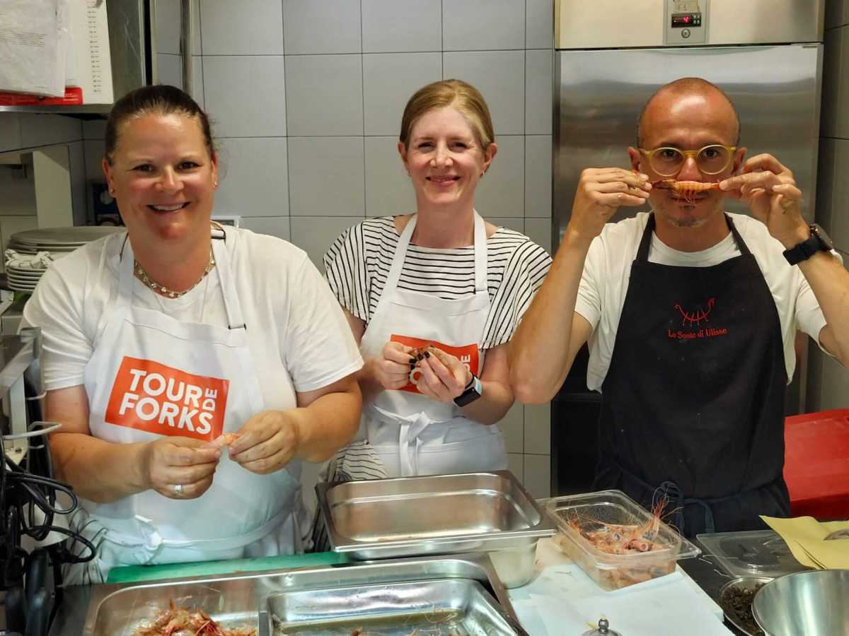 Tour de Forks guests prepping shrimp.