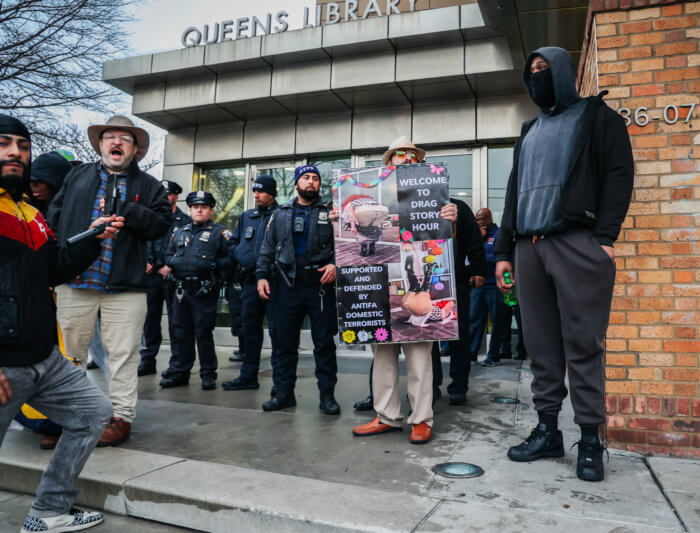 Anti-LGBTQ demonstrators denounce Drag Story Hour.