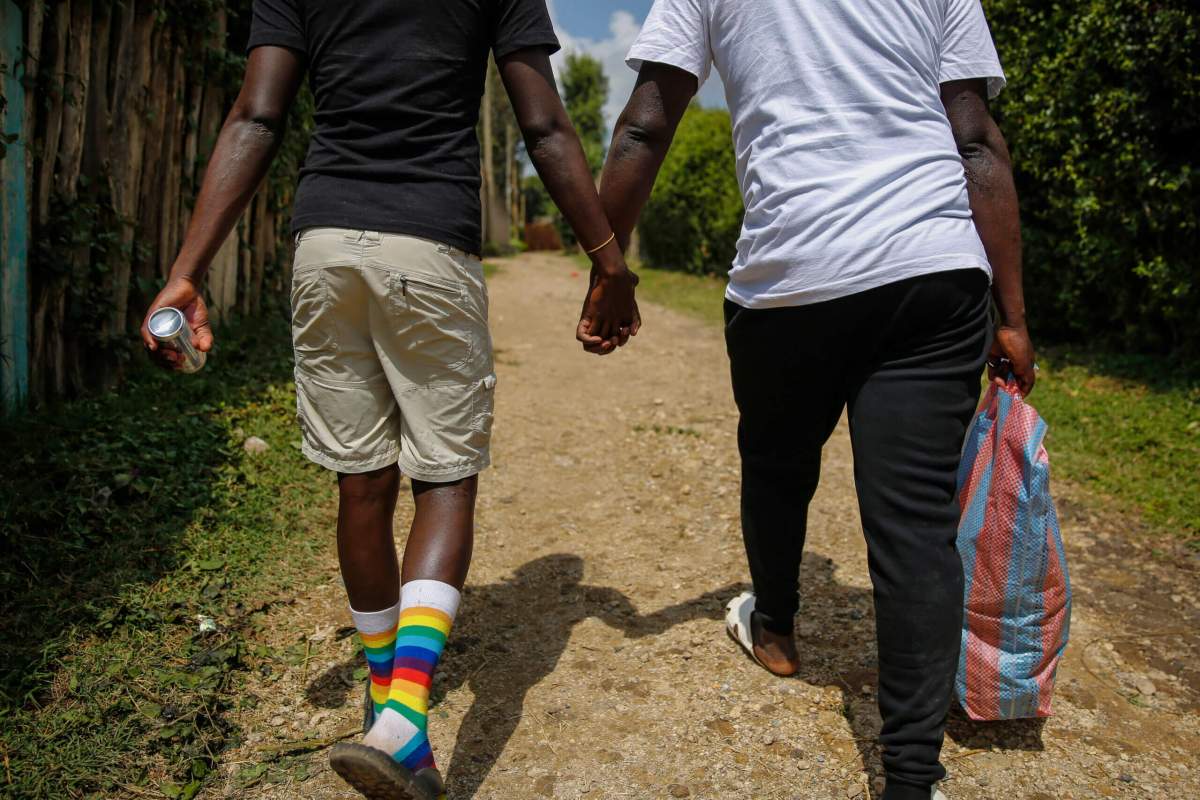 Gay Ugandan refugees who fled from their country to neighboring Kenya, return after shopping for food in Nairobi, Kenya on June 11, 2020.