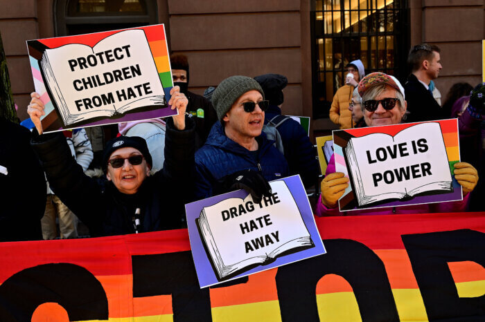 Supporters of drag story hour drown out bigots outside of the LGBT Center.