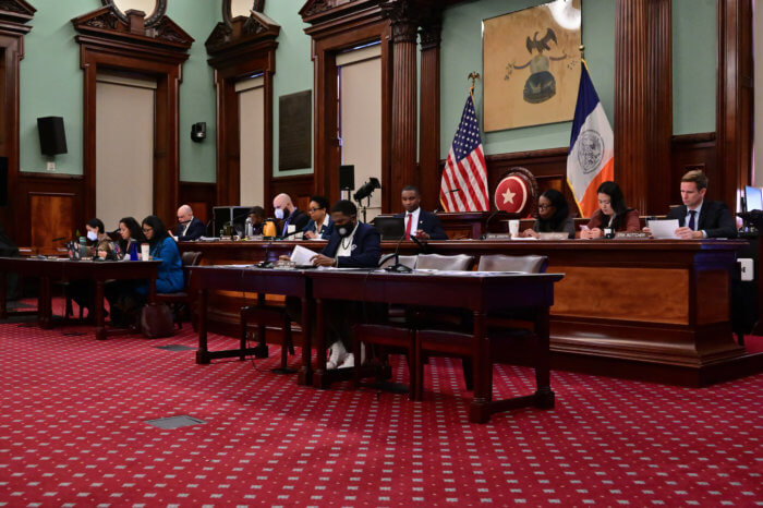 Public Advocate Jumaane Williams sits in front of the Council's Committee on Public Safety in the Council chamber.