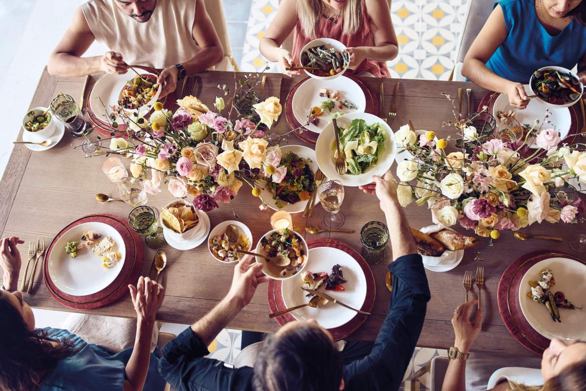 Queer travelers enjoying a meal together at Maroma by Belmond in Playa del Carmen, Cancun, Mexico.