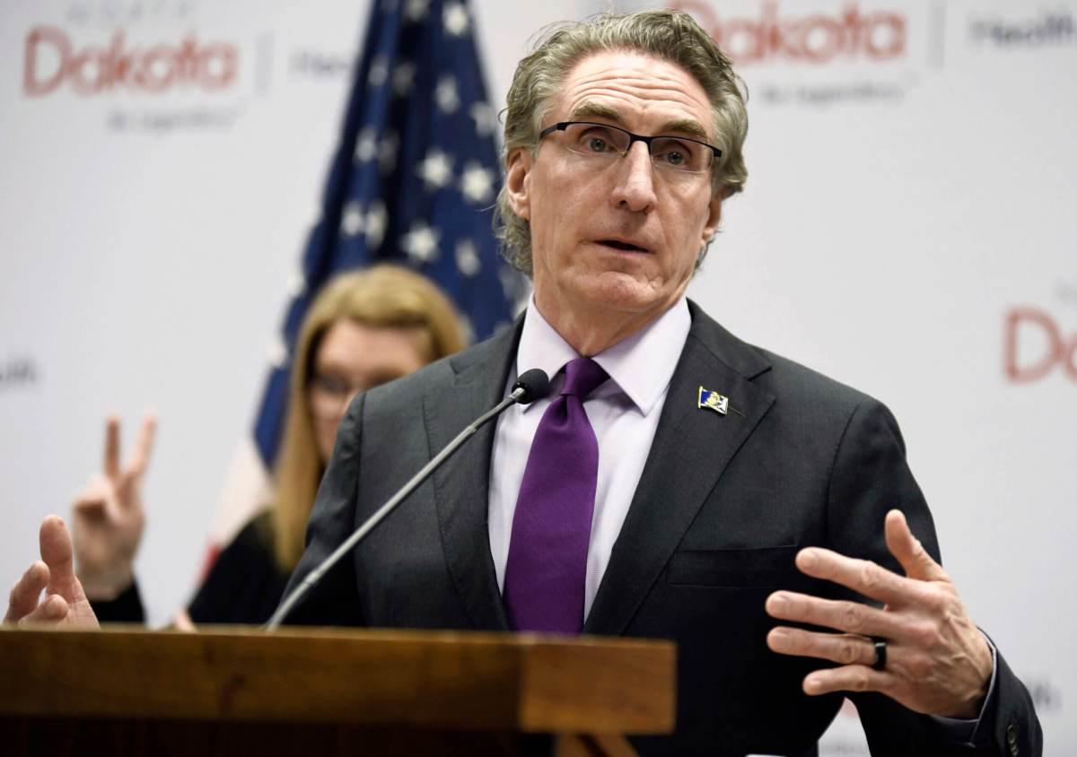 North Dakota Gov. Doug Burgum, who signed anti-trans sports bills, speaks at the state Capitol on April 10, 2020, in Bismarck, N.D.