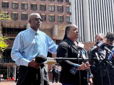 Rickie Trawick and Ellen Trawick, the parents of Kawaski Trawick, standing outside NYPD headquarters on April 24, 2023.