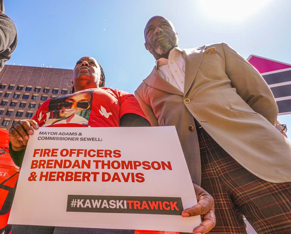 Kawaski Trawick's mother, Ellen Trawick (left), with the family's attorney, Royce Russell (right), at NYPD headquarters on April 12.