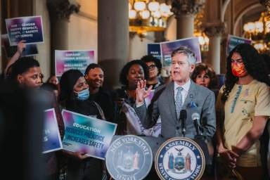 Manhattan State Senator Brad Hoylman-Sigal and LGBTQ advocates in Albany earlier this year.