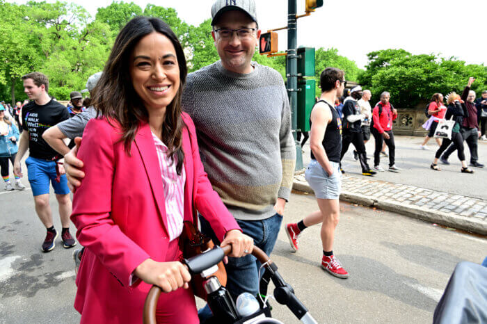 Councilmember Carlina Rivera with her husband, Jamie Rogers, and their child.