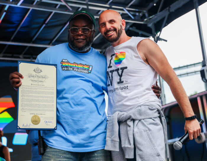 Sean Coleman holds a proclamation from New York State.