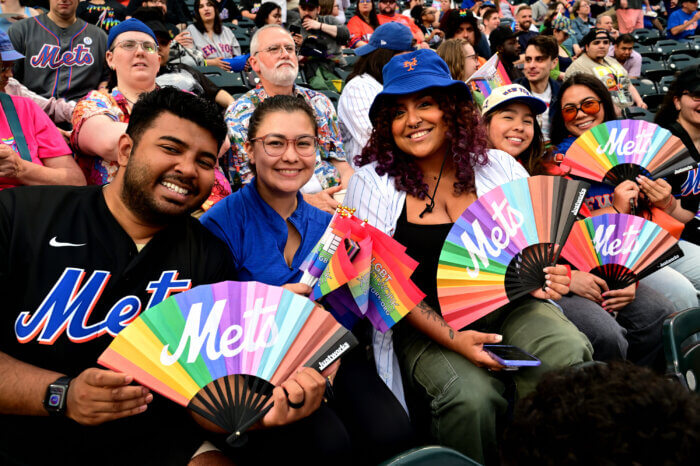 Friends show off their new rainbow fans.