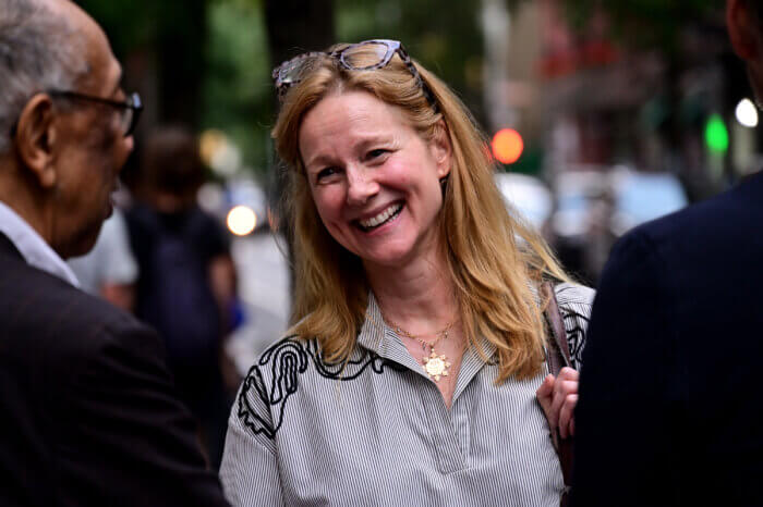 Actress Laura Linney shares a laugh after the memorial.