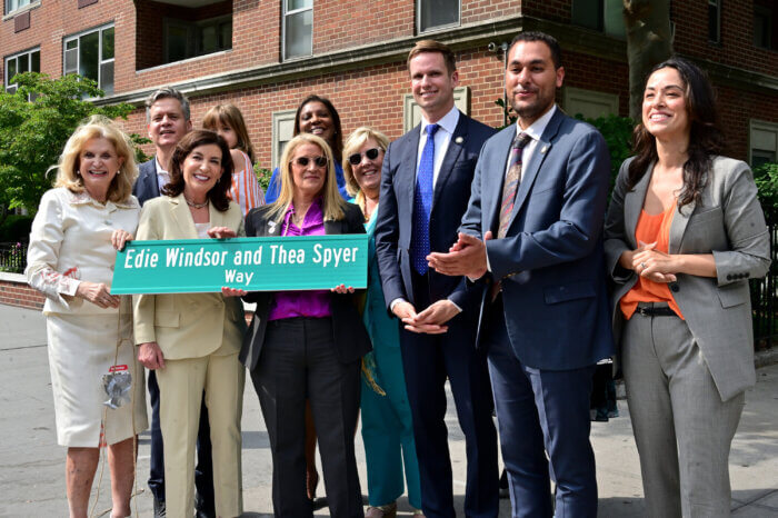 A group shot around the new street sign.