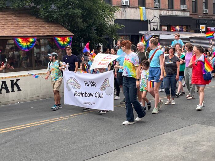 Members of PS 130 make their way through Fifth Avenue.