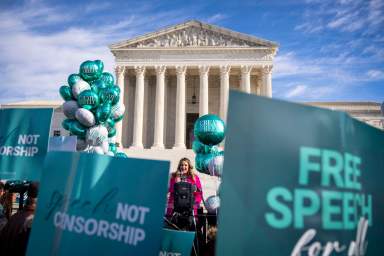 Lorie Smith, a Christian graphic artist and website designer in Colorado, speaks to supporters outside the Supreme Court in Washington, Monday, Dec. 5, 2022, after having her case heard by the court.