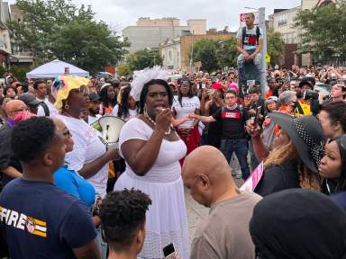 Qween Jean delivers remarks Aug. 4 at the Mobil gas station where O'Shae Sibley was killed.