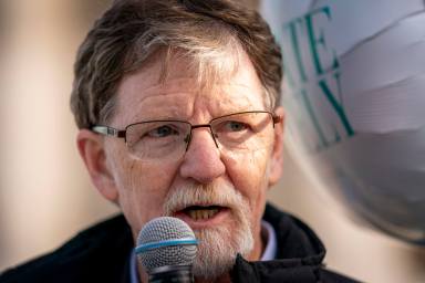 Jack Phillips, whose case was heard by the Supreme Court several years ago after he objected to designing a wedding cake for a gay couple, speaks to supporters outside the Supreme Court, Dec. 5, 2022, in Washington.