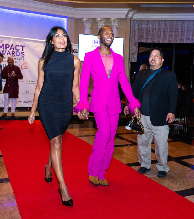 Amanda Tarley, the diversity, equity, and inclusion director as well as the events director, walks with emcee Kenneth Courtney.