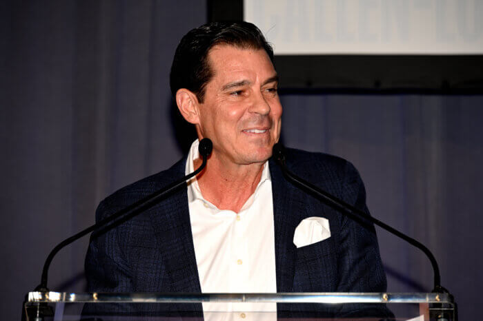 Billy Bean accepts an award from Callen-Lorde.