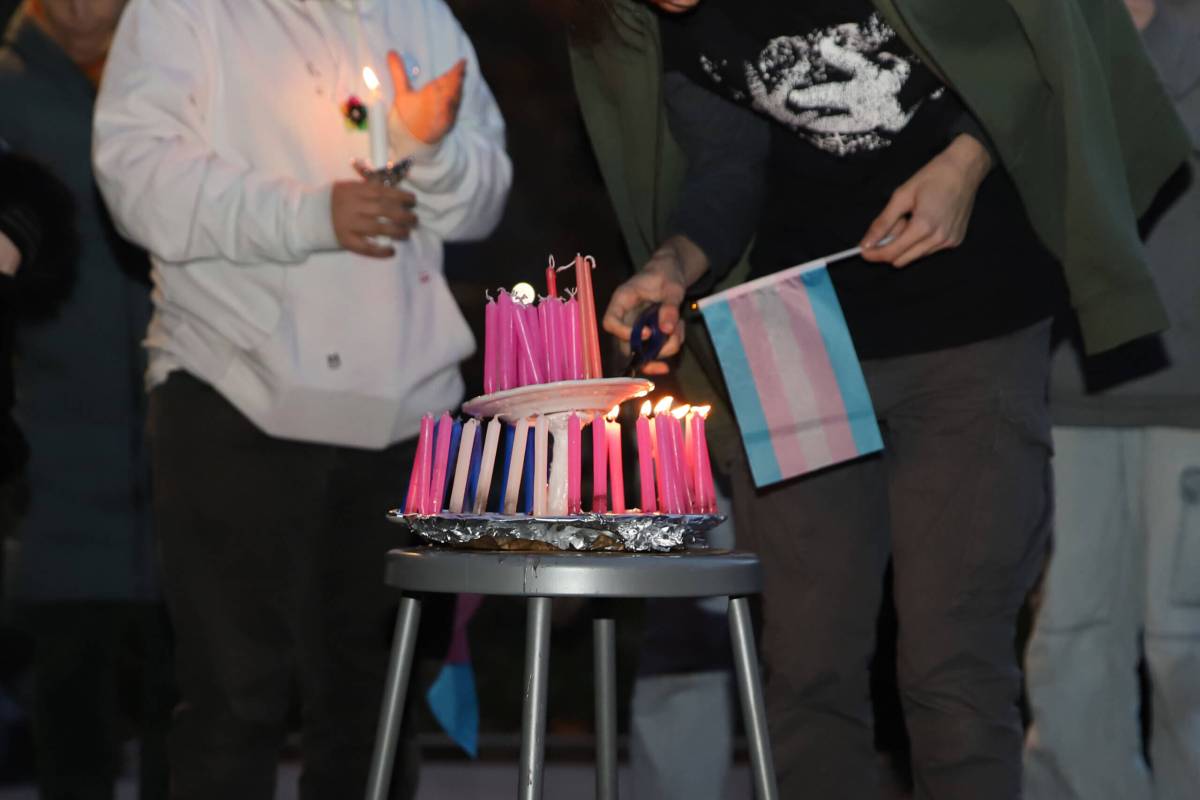 High school students hold a memorial and vigil in Washington Square Park for trans people who have died in the past year.