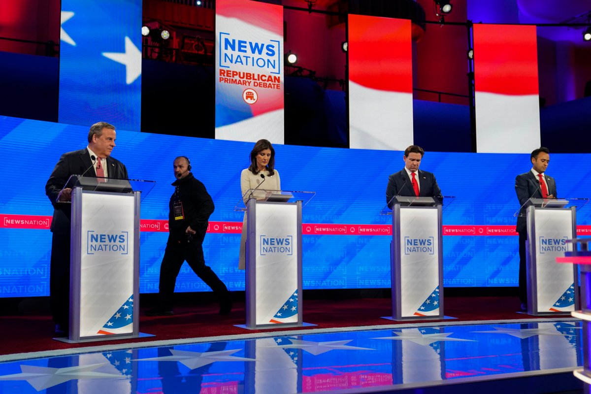 Former New Jersey Gov. Chris Christie, left, former UN Ambassador Nikki Haley, Florida Gov. Ron DeSantis, and businessman Vivek Ramaswamy prepare before a Republican presidential primary debate hosted by NewsNation on Wednesday, Dec. 6, 2023, at the Moody Music Hall at the University of Alabama in Tuscaloosa, Ala.