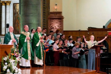 In this photo provided by America Media, from left, the Rev. James Martin, Archbishop John Wester of Santa Fe, N.M., and Rev. Eric Andrews attend the closing Mass for the Outreach conference at the Church of St. Paul the Apostle, in New York, June 18, 2023.