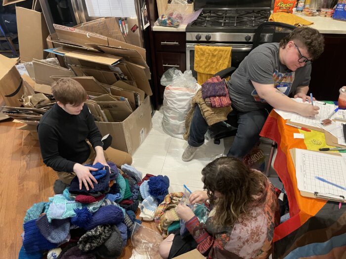 Volunteers hard at work in the kitchen at Knit the Rainbow's day of action.