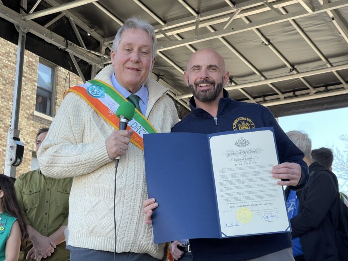 Former Queens City Councilmember Daniel Dromm with a state proclamation.